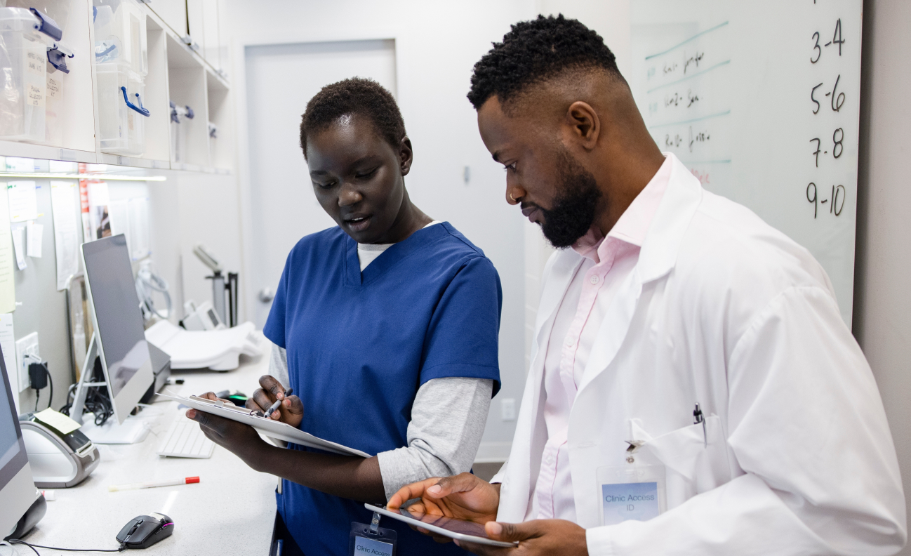 Actor portrayal of a doctor and nurse reviewing data
